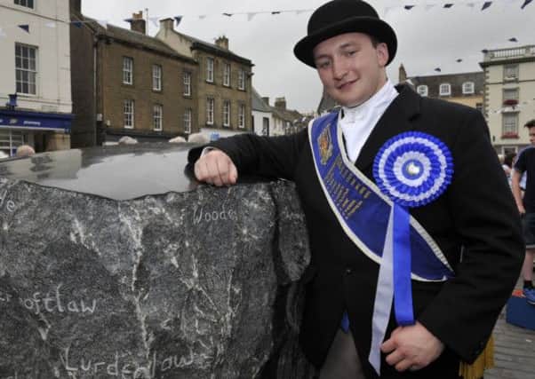 The unvieling of the 'Kelsae Stane' in Kelso Square. The Kelso Laddie Ross Henderson in photo and who helped with the unvieling.