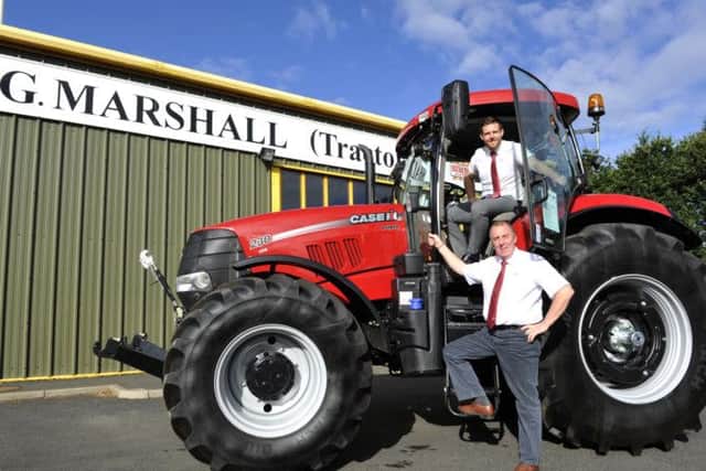 David Marshall, in the cab, has joined his father George in the family run firm, which is based at Charlesfield Industrial Estate