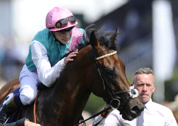 CHICHESTER, ENGLAND - JULY 30:  James Doyle riding Kingman wins The Qipco Sussex Stakes from at Goodwood racecourse on July 30, 2014 in Chichester, England. (Photo by Alan Crowhurst/Getty Images)