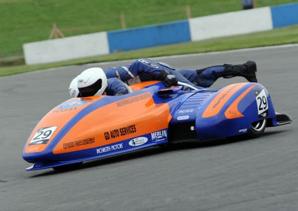 The Kershaw sidecar team show their speed at the 2.4 mile iconic Donington Park circuit in Leicestershire