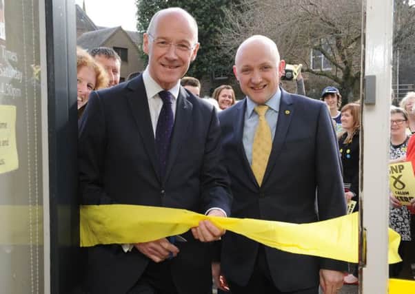 Deputy First Minister John Swinney MSP and Calum Kerr, Westminster candidate for Berwickshire, Roxburgh and Selkirk,were in Galashiels to officially open the SNPs general election campaign hub on Bank Street.