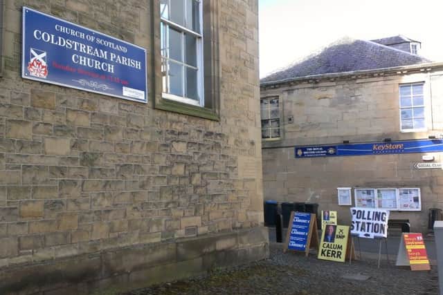 Coldstream polling station signs outside the parish church leading people to the parish church room behind the building