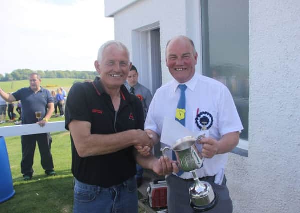Golden Mile -  Colin 'Shavie' Davis, one of the owners of winner Mr Mo recieves the trohpy and the £1000 cheque from committee member and judge Gary Haldane.