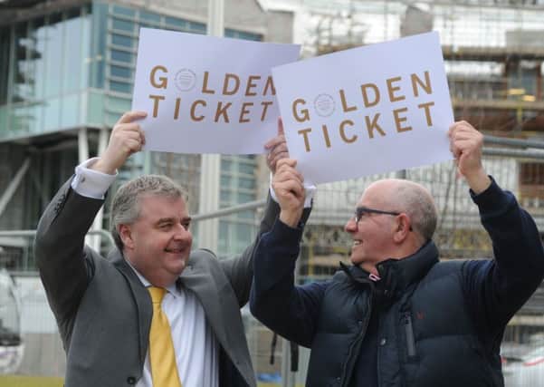 David Parker of SBC with David Romanis near to the site of the new Galashiels Interchange with 'Golden Tickets'.