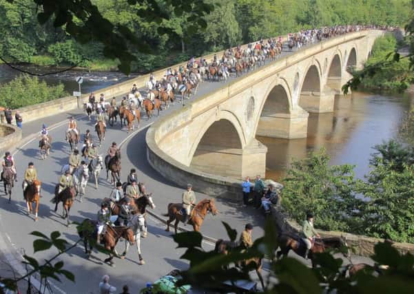 The 350 horses and riders who took part in the annual Flodden cavalcade returning to Scotland over Coldstream bridge.