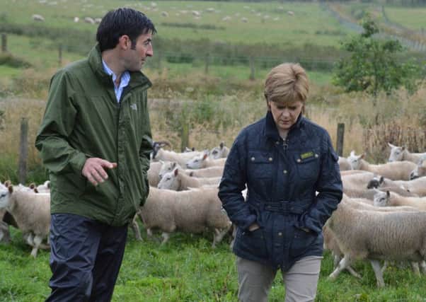 First Minister Nicola Sturgeon chats with Hamish Dykes at South Slipperfield Farm, West Linton.