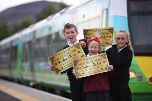Primary 7 pupils from Langlee Primary in Galashiels, Lacey Harris, Colby Wylie and Keira Vincentini, who all took part in a Golden Ticket competition pose at Tweedbanktoday. Picture: VisitScotland
