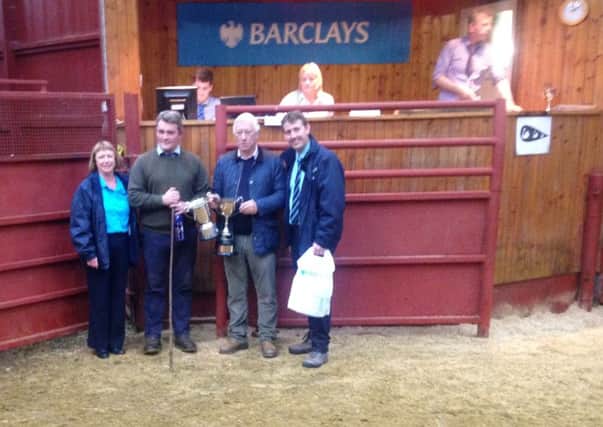 At John Swan Ltds Show and Sale last week the Charolias champion was a steer from Fawdon Farms. Left to right are Ann Bennett (Barclays), James Gay (Fawdon Farms), judge Alistair Patterson and Nick Sheffer (Barclays).