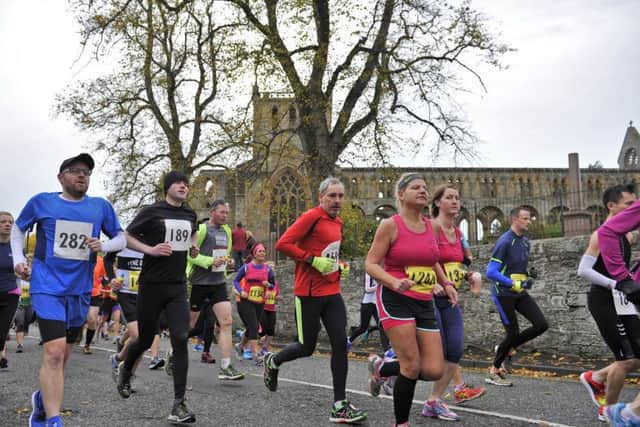 Jed Running Festival. The start of the race saw athletes running past Jedburgh Abbey.