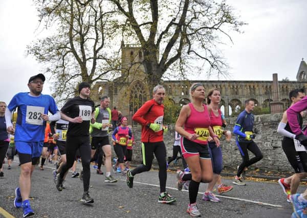 Jed Running Festival. The start of the race saw athletes running past Jedburgh Abbey.