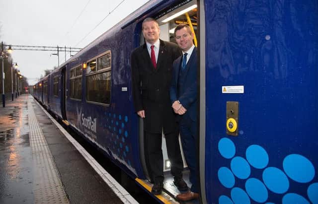 SBBN-31-12-15
They show Derek Mackay, Minister for Transport & Islands, with ScotRail Alliance MD Phil Verster on board the first of ScotRails Class 318 fleet to be fitted with at-seat power sockets.