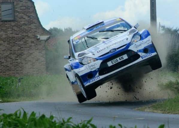 Euan Thorburn gets his Ford Fiesta S2000 onto two wheels during the 2015 FIA ERC Ypres Rally.