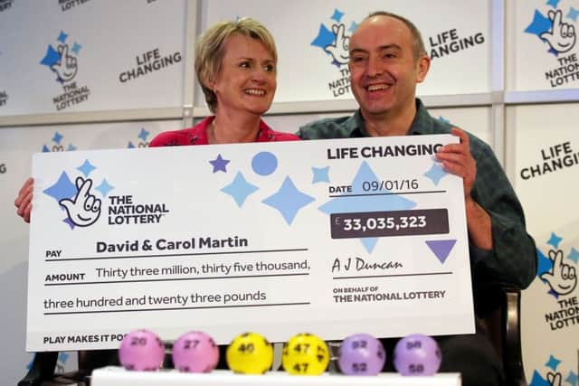 David and Carol Martin, a husband and wife from Hawick, celebrate after winning half of the historic Â£66 million Lotto jackpot. Picture: Andrew Milligan/PA Wire