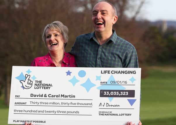 David and Carol Martin, a husband and wife from Hawick in the Scottish Borders, celebrate at the Dalmahoy Hotel & Country Club in Edinburgh after winning half of the historic Â£66 million Lotto jackpot. PRESS ASSOCIATION Photo. Picture date: Wednesday January 13, 2016. The rollover Lotto prize was split between two tickets that had all six winning numbers from Saturday's draw - 26, 27, 46, 47, 52 and 58. See PA story LOTTERY Winners. Photo credit should read: Andrew Milligan/PA Wire