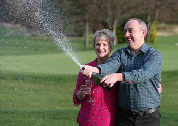 David and Carol Martincelebrate their jackpot win. Picture: Andrew Milligan/PA Wire