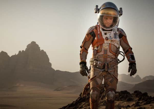 This photo released by 20th Century Fox shows Matt Damon in a scene from the film, "The Martian." Damon was nominated for a Golden Globe award for best actor in a motion picture musical or comedy for his role in the film on Thursday, Dec. 10, 2015. The 73rd Annual Golden Globes will be held on Jan. 10, 2016.  (Aidan Monaghan/20th Century Fox via AP)