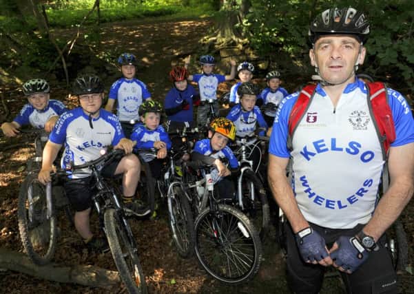 Ian McKenzie with youngsters of Kelso Wheelers at the proposed site for a new bike track in Kelso.