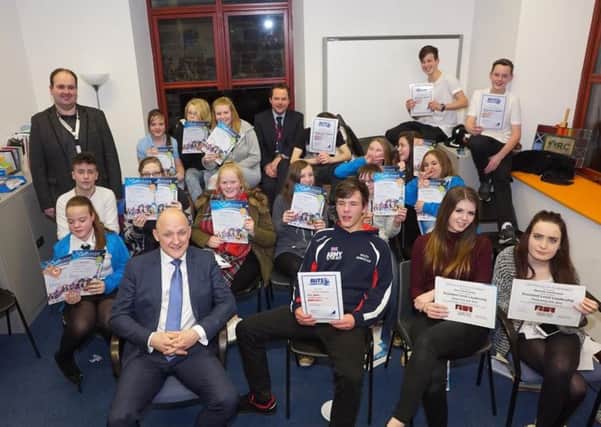 Young people with their certificates, along with  Galashiels Academy head teacher Kevin Ryalls and TD1 Youth Hub manager Douglas Ormiston