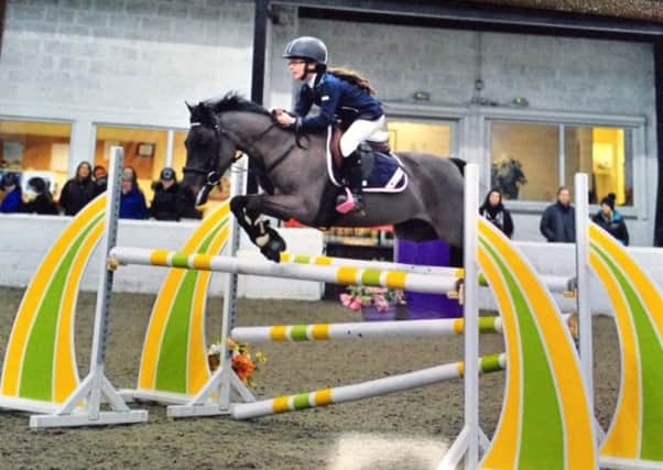 Lauder primary school pupil Amy Morris has qualified for the final of the   Royal International Horse Show at Hickstead later this year on her 128cm pony Madonna.