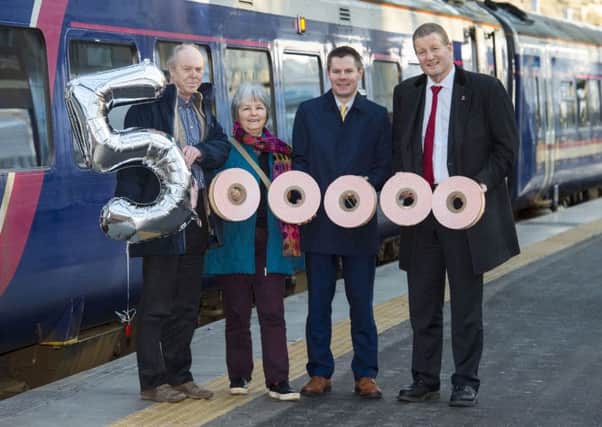 28/01/16 - 16012801 - FIRST SCOTRAIL  
  WAVERLY STATION - EDINBURGH  
  (L/R) Passengers, Andy Swales and Sarah Eno are joined by Transport Minister, Derek Mackay and Managing Director of the ScotRail Alliance, Phil Verster to mark passing half a million passengers on the Borders Railway
