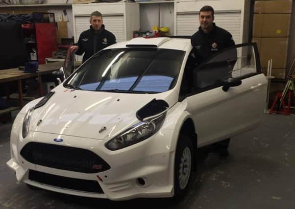 Duns rally driver Garry Pearson (right) with co-driver Robbie Mitchell and their new Ford Fiesta R5.