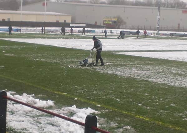 Clearing the snow at Netherdale (Gala RFC)