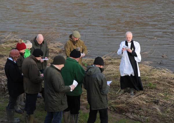 Rev Rob Kelsey blesses the Tweed at Pedwell landing Norham, to mark the opening of the salmon fishing season.