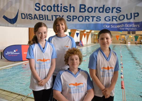 Picture shows : Borders Barracudas disability swim squad
Beth Johnson, Louise Johnson (adult) front Donald Gray and right Finlay Lindores.