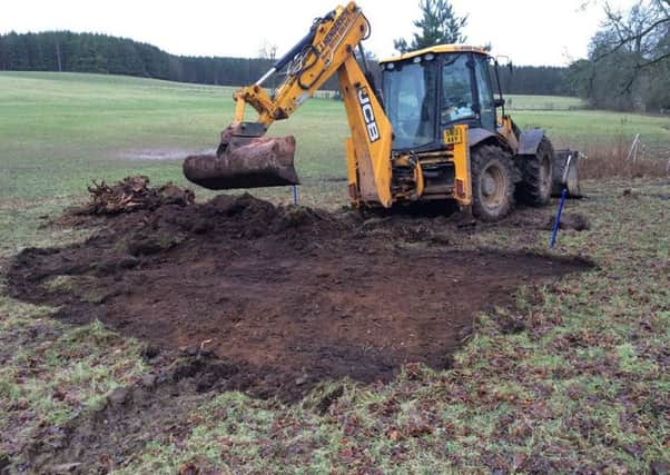 Ian Henderson hard at work preparing the ground for Ettrick Forest Archers' new clubhouse