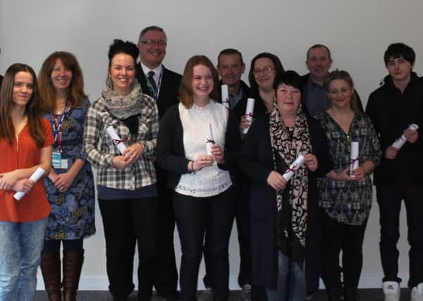 'Train to Care' students who were presented with their qualification at an awards ceremony at Job Centre Plus, Galashiels, plus course staff