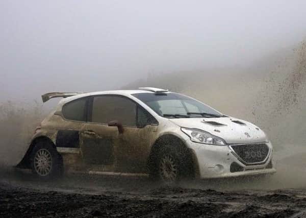 Euan Thorburn tested his new Peugeot 208 at a very wet Sweetlamb Rally complex.
