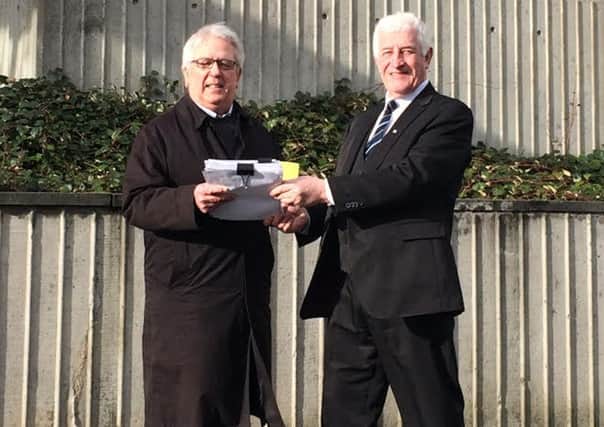 Petition with 4,303 signatures handed over to SBCs depute convener Jim Brown by campaigner Brian McCrow.