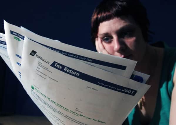 PICTURE BY SEAN BELL.  07977 231320  
GENERIC IMAGES OF GIRL WITH INLAND REVENUE TAX FORMS.
