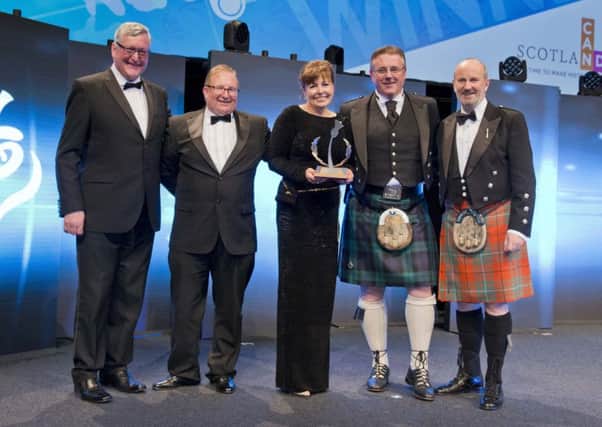 From left, Fergus Ewing MSP, Minister For Business, Energy and Tourism;  Tom Carter;  Anne Woodcock; Mark Cockburn, FishPals chief executive, and comedian Fred MacAulay, who hosted the awards. (Picture by Chris Watt.)