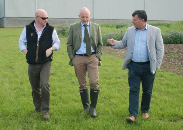 Calum Kerr (centre) during a farm visit to McGregor Farms, Coldstream with Colin McGregor (left) and NFU Scotland President Allan Bowie (right).