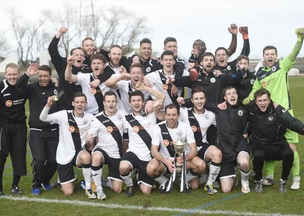 Edinburgh City celebtrate winning the title after a  1-0 win over Stirling University.