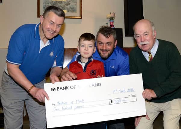 Stewart Clark, Right Worshipful Master, St Johns Coldstream 280, Masonic Lodge presents a cheque for Â£100 to Charlie and Barry Hamilton, representitives of the group Meeting of Minds (Autism Coldstream) along with Councillor John Greenwell