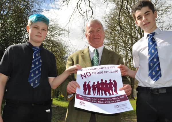 SBSBR Hawick High News members Natasha Burns and Daniel Frankland join Cllr David Paterson to help launch their dog fouling video and a new poster campaign by Scottish Borders Council
