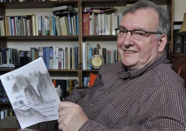 Brian Holton of Melrose with his new book of Chinese verses which he has translated into Scots called, 'Staunin Ma Lane'.