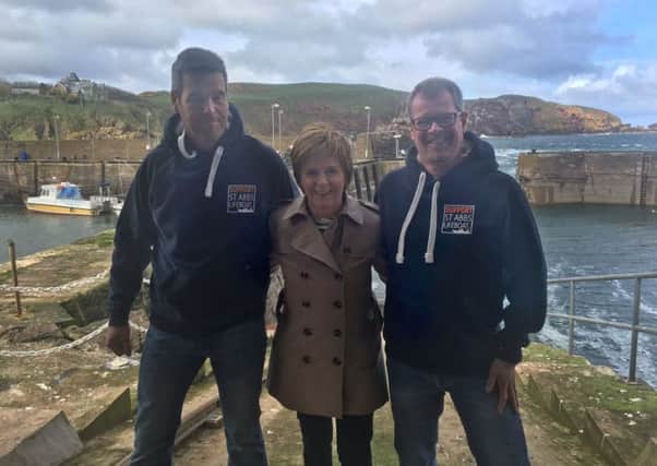 Nicola Sturgeon visinting St Abbs lifeboat campaigners Paul Crowe and Euan Gibson