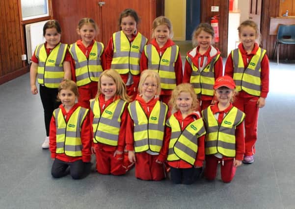 Galashiels Rainbows, with their new high visibility vests donated by Specsavers opticians.