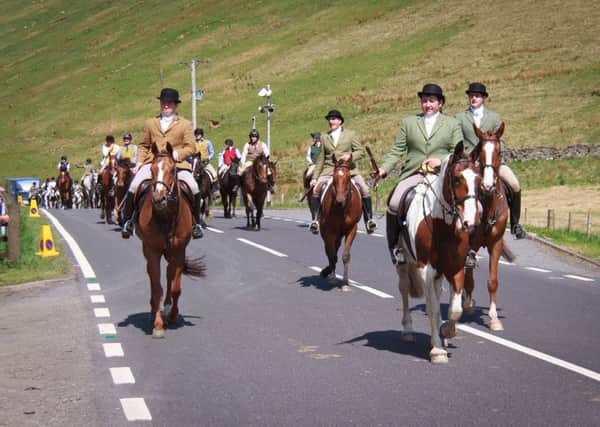 Hawick Cornet Euan Reilly leads the parade of horses to Mosspaul on Saturday.