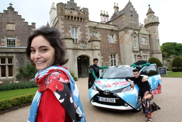 Marta Axpe with her winning design, and wearing a matching scarf, at Abbotsford, near Tweedbank. Photo: Tom Finnie.