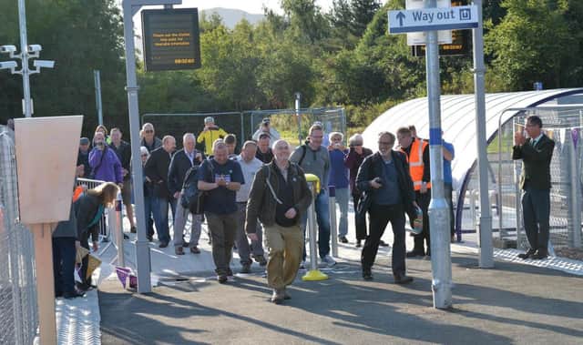 Passengers at Tweedbank rail station on its first day of operation last September.