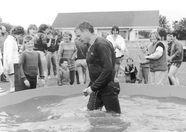 'It's a Knockout' comp organiser John Brown gets soaked.