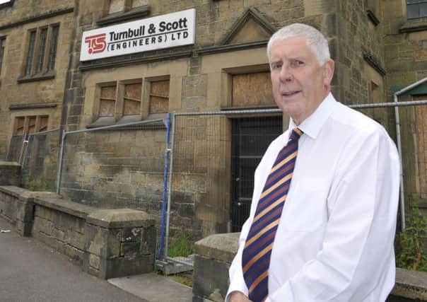 Councillor Ron Smith outside the old Turnbull & Scott building in Hawick.