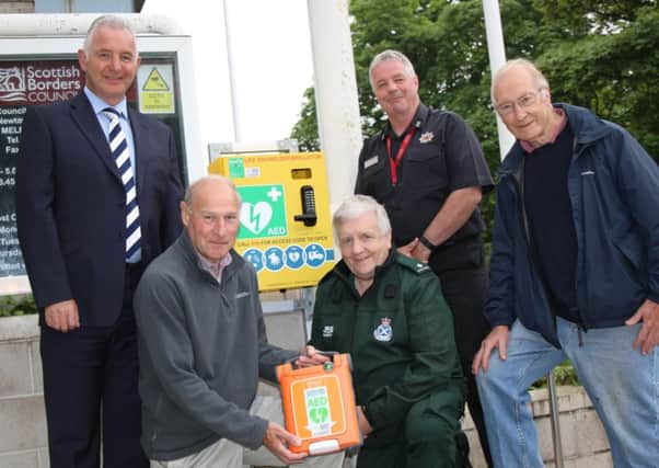 Pictured with new defibrillator at Scottish Borders Council HQ in Newtown St Boswells are, from left, the council's Jim Fraser, George Luke of Newtown and Eildon Community Council, Colin Baxter of the Scottish Ambulance Service, Scott Forbes of the Scottish Fire and Rescue Service, and Roger French of Newtown and Eildon Community Council.