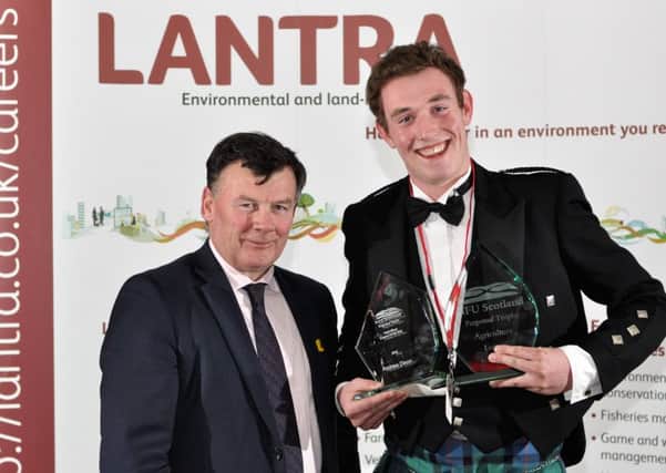 Andrew being presented with his Lantra Learner of the Year Award from Allan Bowie, President of NFU Scotland.