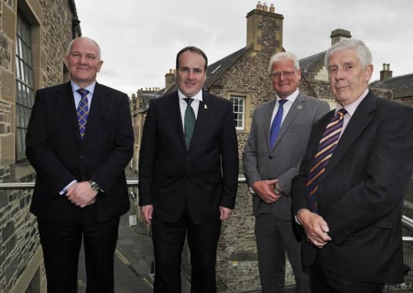 MSP Paul Wheelhouse, second from left, discussing the regeneration bid announced this week with Hawick councillors, from left, Watson McAteer, Stuart Marshall and Ron Smith.