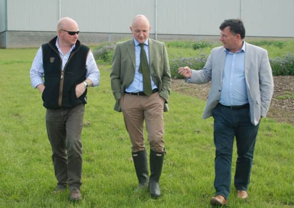 Calum Kerr (centre) during a farm visit to McGregor Farms, Coldstream with Colin McGregor (left) and NFU Scotland President Allan Bowie (right).